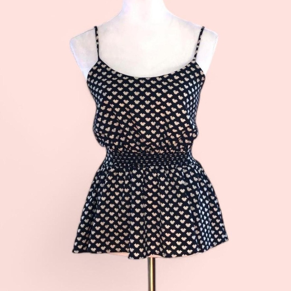 Peplum top with bow tie print